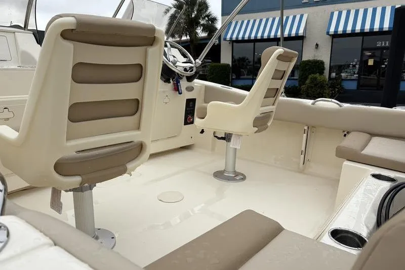 Slide: The Image of 2026 Scout 195 Sport Dorado boat interior with Yamaha outboard motor. - 10