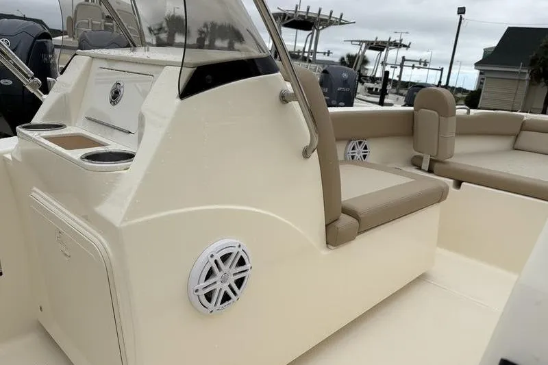 Slide: The Image of Control panel on 2026 Scout 195 Sport Dorado boat with warning label. - 16