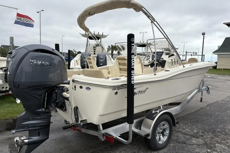 Slide: The Image of 2026 Scout 195 Sport Dorado boat with Yamaha 150 outboard motor, rear view. - 4
