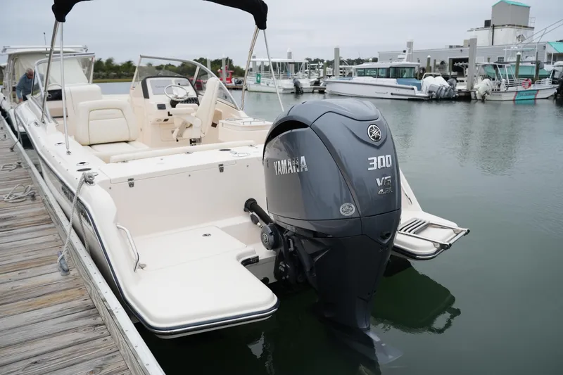 Slide: The Image of 2022 Grady-White Freedom 235 boat with Yamaha 300 engine docked at marina. - 18