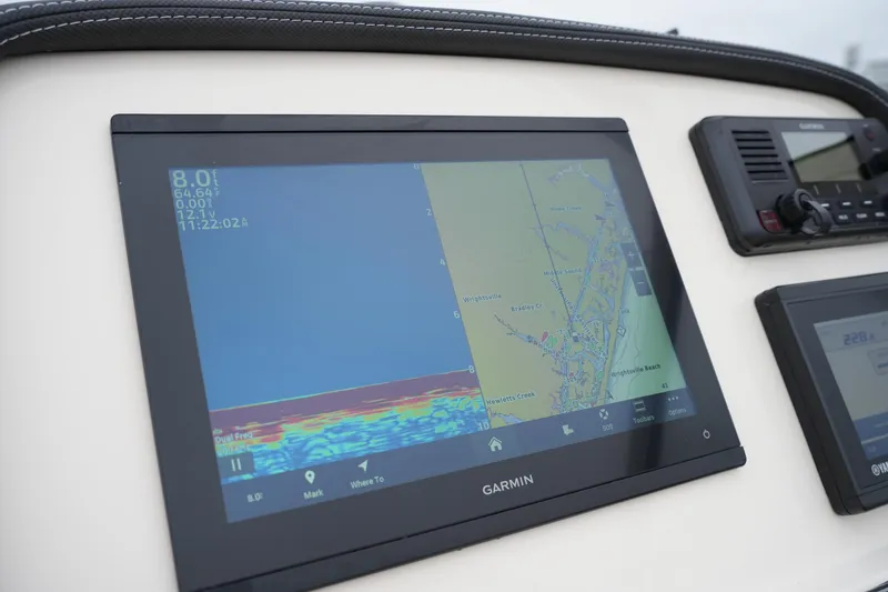 Slide: The Image of Garmin navigation display on 2022 Grady-White Freedom 235 boat dashboard. - 29