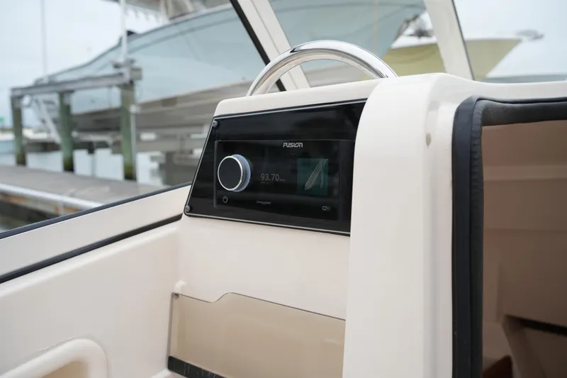 Slide: The Image of 2022 Grady-White Freedom 235 boat dashboard with Fusion stereo system. - 33