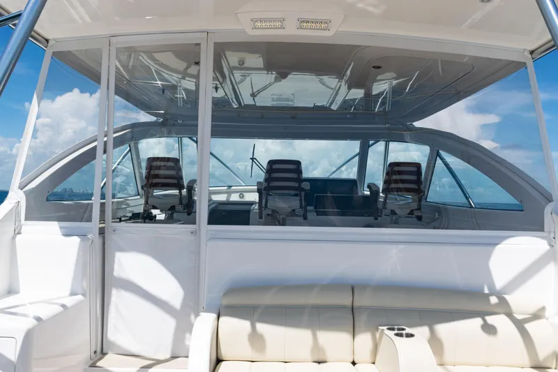 Slide: The Image of 2021 Viking 44 Open yacht interior with helm chairs and panoramic windows. - 10