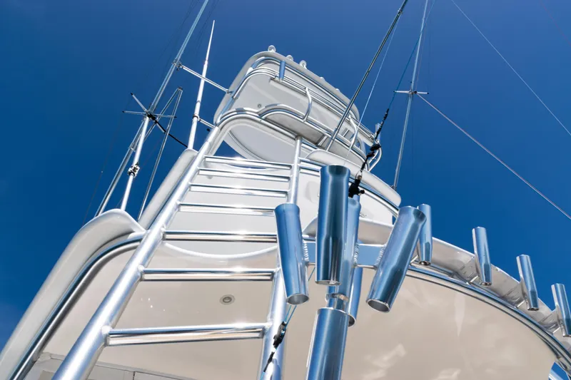 Slide: The Image of 2021 Viking 44 Open yacht tower against clear blue sky. - 13