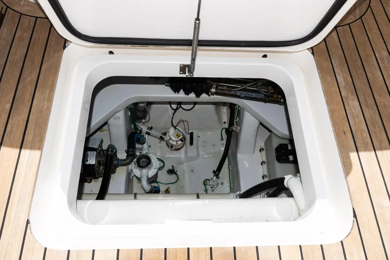 Slide: The Image of Engine compartment of 2021 Viking 44 Open yacht, showcasing mechanical components and clean design. - 17