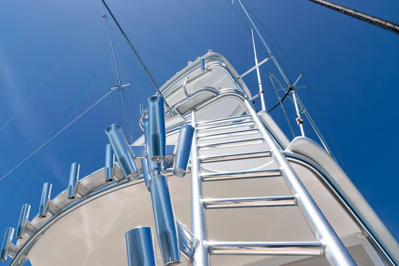 Slide: The Image of 2021 Viking 44 Open yacht tower with ladder against clear blue sky. - 29