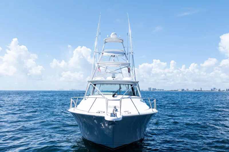 Slide: The Image of 2021 Viking 44 Open yacht on open sea under clear blue sky. - 3