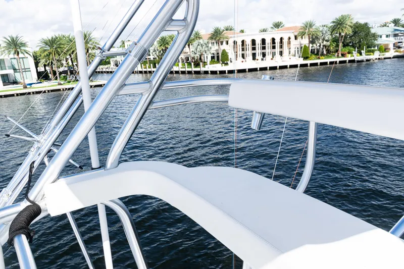 Slide: The Image of 2021 Viking 44 Open yacht with sleek railing, overlooking waterfront luxury homes. - 33