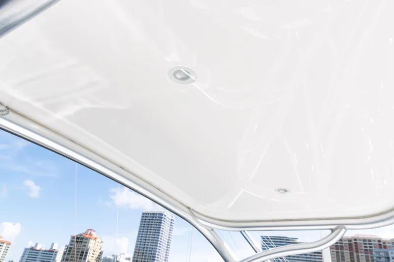 Slide: The Image of 2021 Viking 44 Open boat roof with city skyline background. - 34