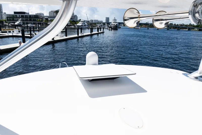 Slide: The Image of 2021 Viking 44 Open yacht docked at marina with clear blue water. - 38