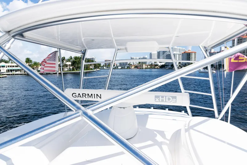 Slide: The Image of 2021 Viking 44 Open boat with Garmin xHD2 radar on a sunny waterfront. - 39