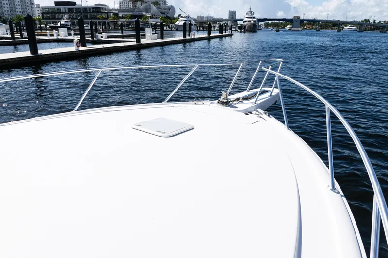 Slide: The Image of Bow view of 2021 Viking 44 Open yacht docked at marina. - 47