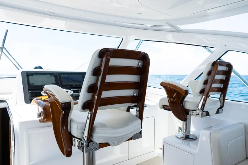 Slide: The Image of Luxurious helm chairs on 2021 Viking 44 Open yacht with ocean view. - 60