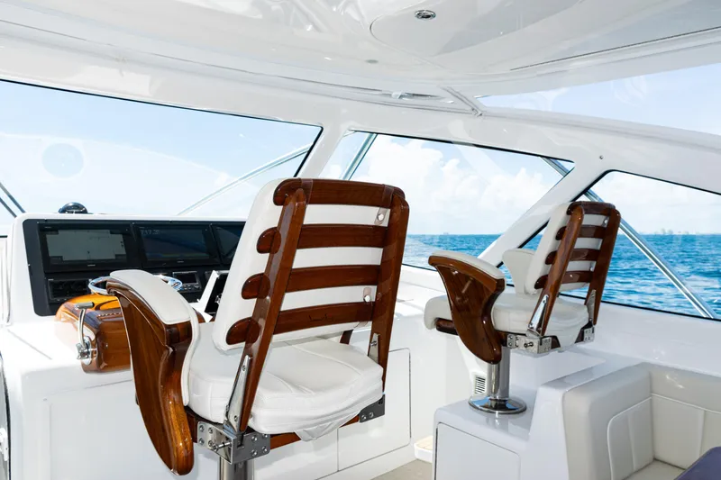 Slide: The Image of Interior of 2021 Viking 44 Open yacht with luxurious helm chairs and ocean view. - 62
