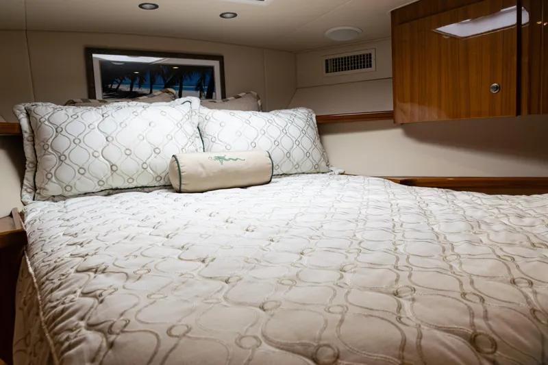 Slide: The Image of Luxurious cabin interior of 2021 Viking 44 Open yacht with elegant bedding. - 68
