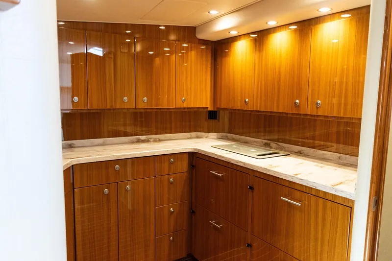 Slide: The Image of Luxurious wooden cabinetry in 2021 Viking 44 Open yacht kitchen interior. - 75