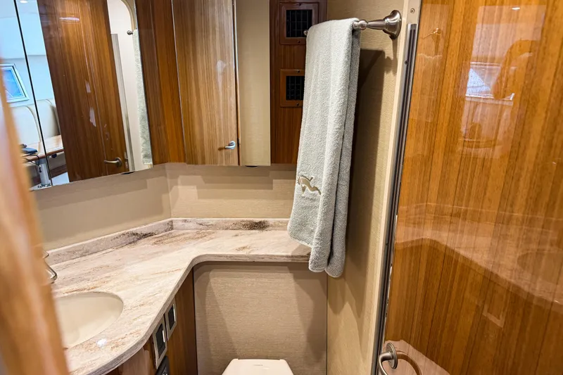 Slide: The Image of Luxurious bathroom interior of 2021 Viking 44 Open yacht with wooden finishes. - 79
