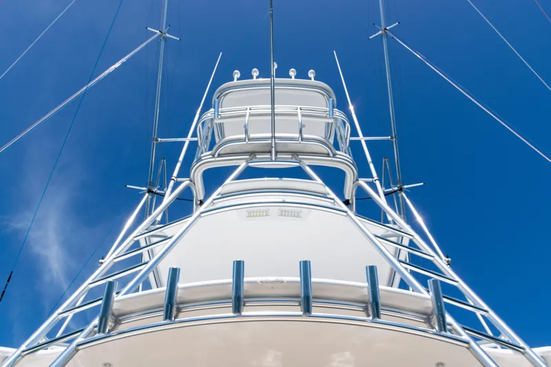 Slide: The Image of 2021 Viking 44 Open yacht tower against clear blue sky. - 8