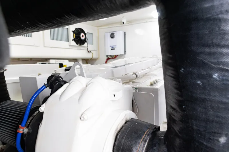 Slide: The Image of Engine room of 2021 Viking 44 Open yacht, showcasing mechanical components. - 86