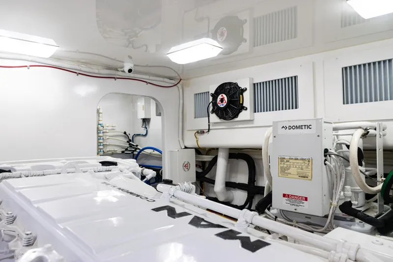 Slide: The Image of Engine room of 2021 Viking 44 Open yacht, featuring Dometic equipment and clean, organized layout. - 90