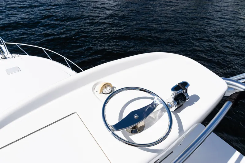 Slide: The Image of Steering wheel of 2021 Viking 44 Open yacht on calm water. - 94