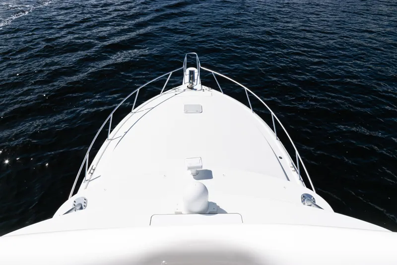 Slide: The Image of Bow view of 2021 Viking 44 Open yacht on open water. - 95