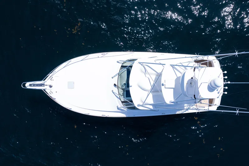 Slide: The Image of Overhead view of 2021 Viking 44 Open yacht on dark blue water. - 98