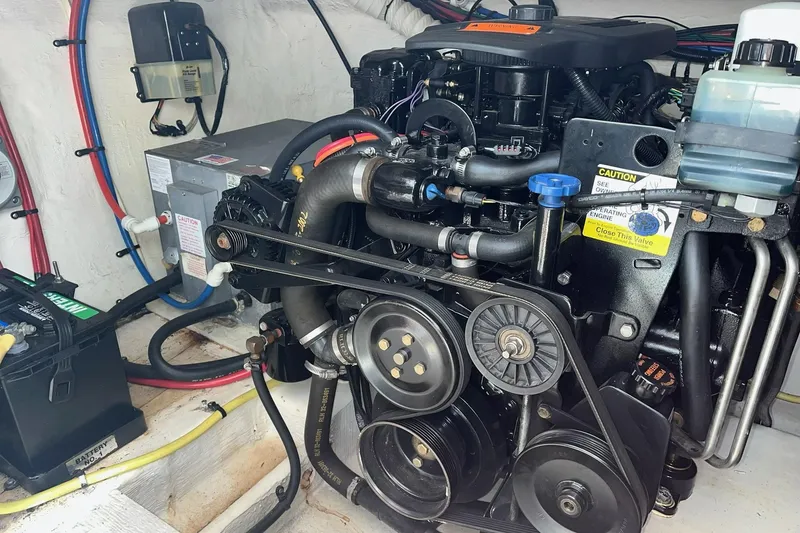 Slide: The Image of Engine compartment of a 2003 Cruisers Yachts 2870 Express, showcasing mechanical components. - 23