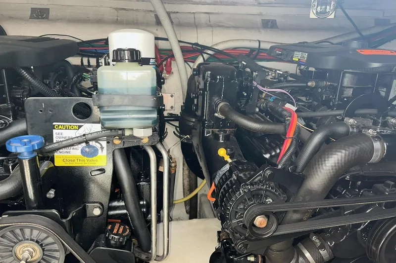 Slide: The Image of Engine compartment of a 2003 Cruisers Yachts 2870 Express boat, showing detailed components. - 26