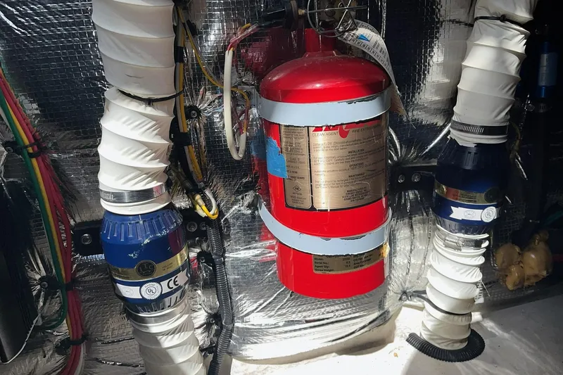 Slide: The Image of Engine room of 2003 Cruisers Yachts 2870 Express with fire extinguisher and ventilation system. - 27