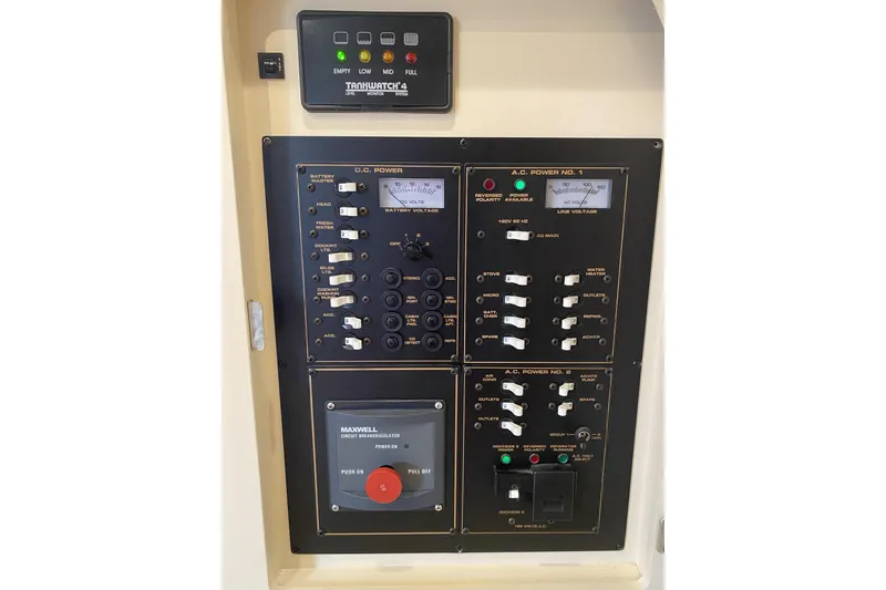 Slide: The Image of Control panel of a 2003 Cruisers Yachts 2870 Express, featuring power switches and indicators. - 21