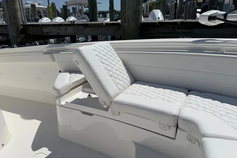 Slide: The Image of Luxurious seating on 2025 Regulator 30XO boat with quilted white upholstery. - 52