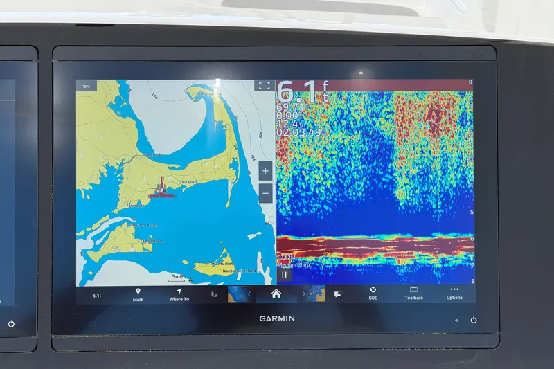 Slide: The Image of Garmin marine display on 2025 Regulator 30XO showing navigation and sonar data. - 33