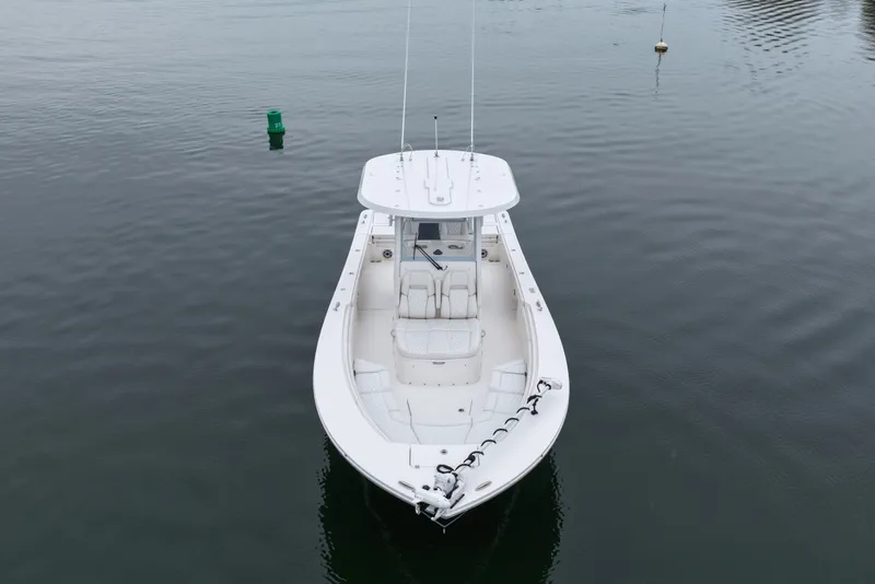 Slide: The Image of 2025 Regulator 30XO boat on calm water, aerial view. - 13