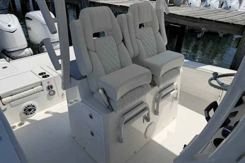 Slide: The Image of Luxury seating on 2025 Regulator 30XO boat, featuring plush, diamond-stitched upholstery. - 44