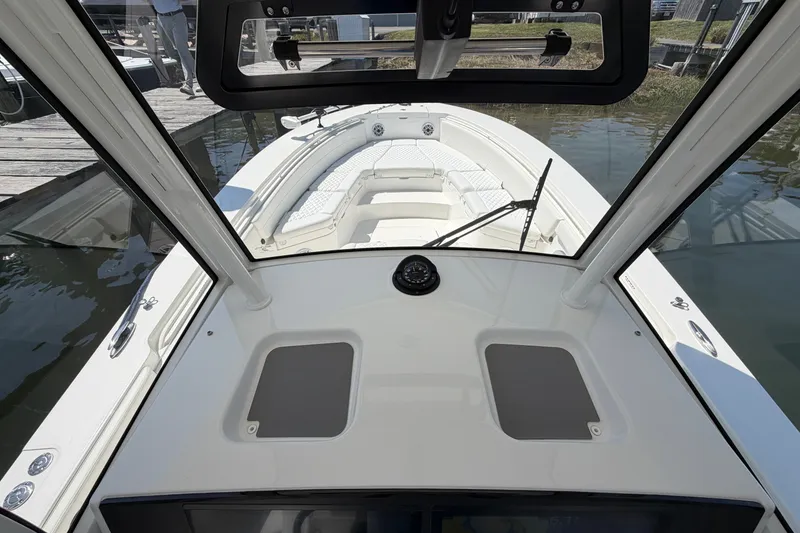 Slide: The Image of 2025 Regulator 30XO boat interior view with seating and dashboard. - 42