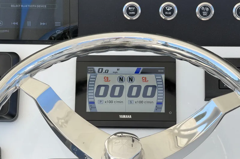 Slide: The Image of Steering wheel and dashboard of 2025 Regulator 30XO boat with Yamaha display. - 35