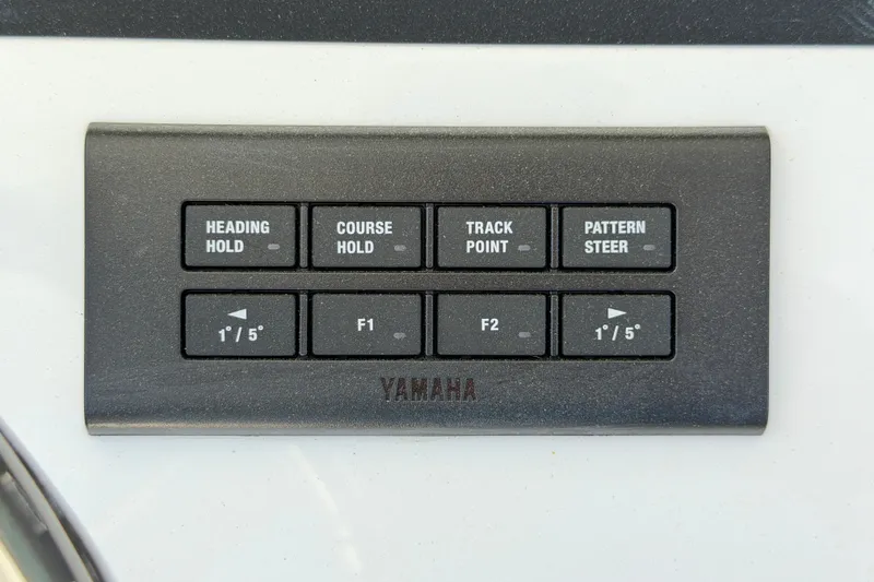 Slide: The Image of Control panel of a 2025 Regulator 30XO boat with Yamaha navigation buttons. - 41