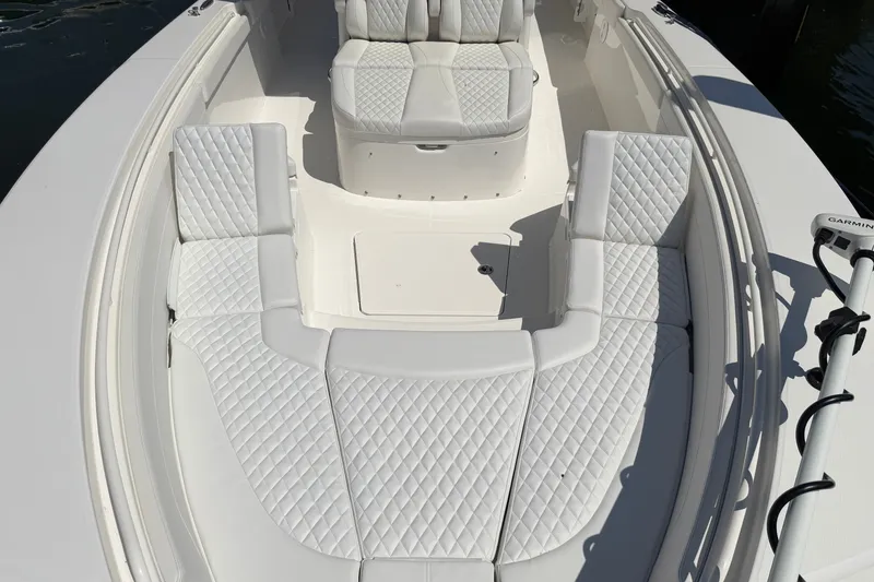 Slide: The Image of 2025 Regulator 30XO boat interior with luxurious white quilted seating. - 51