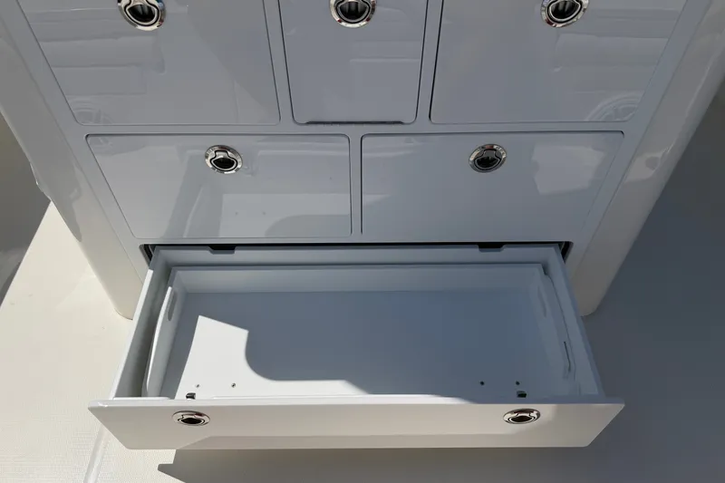 Slide: The Image of Open storage drawer on 2025 Regulator 30XO boat, showcasing sleek design and functionality. - 26