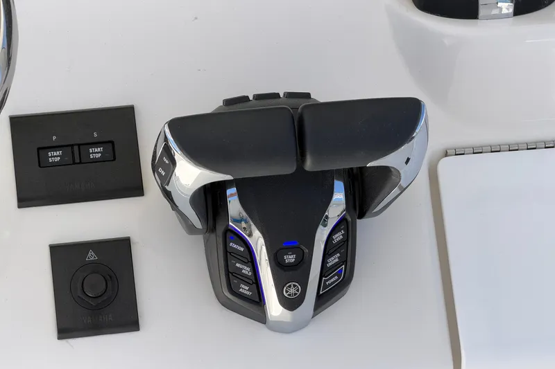 Slide: The Image of Control panel of 2025 Regulator 30XO boat with Yamaha throttle and start-stop buttons. - 36