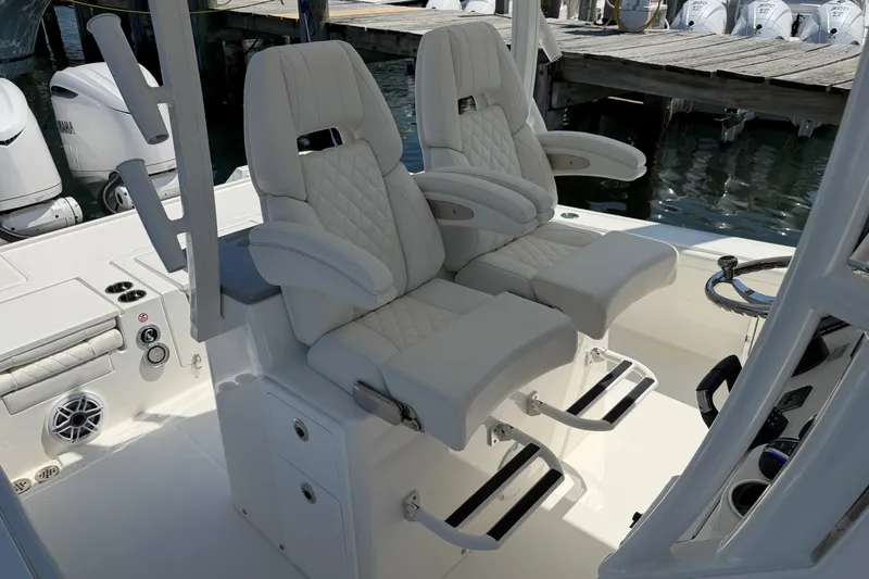 Slide: The Image of 2025 Regulator 30XO boat interior with luxurious seating and modern controls. - 45