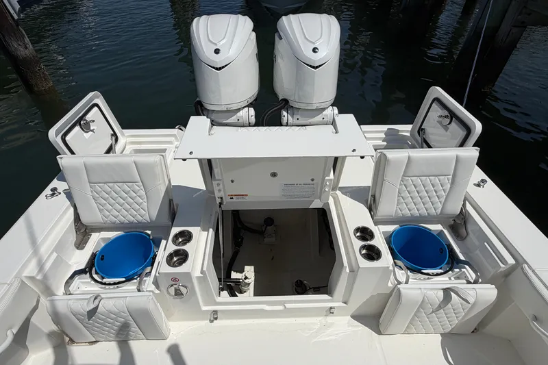 Slide: The Image of 2025 Regulator 30XO boat interior with dual engines, seating, and storage compartments. - 20