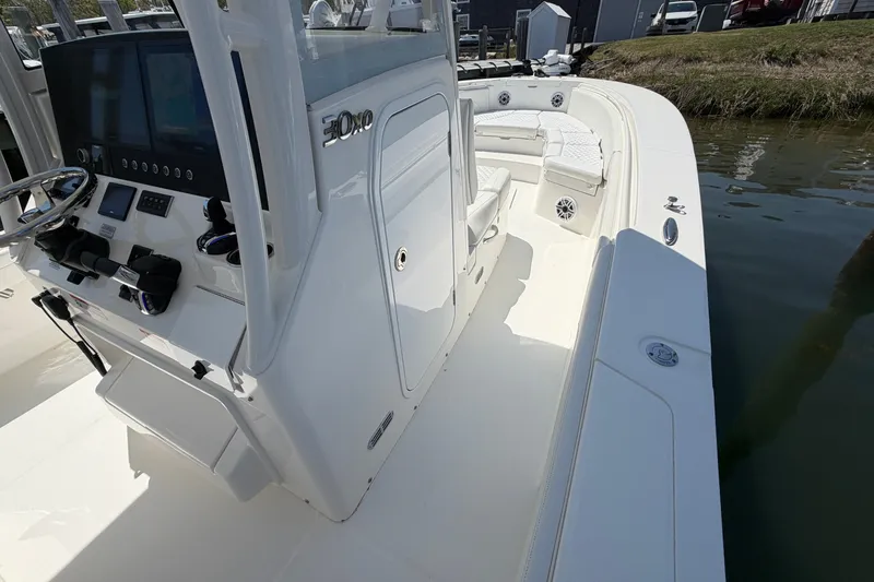 Slide: The Image of 2025 Regulator 30XO boat interior with helm, seating, and modern controls. - 46
