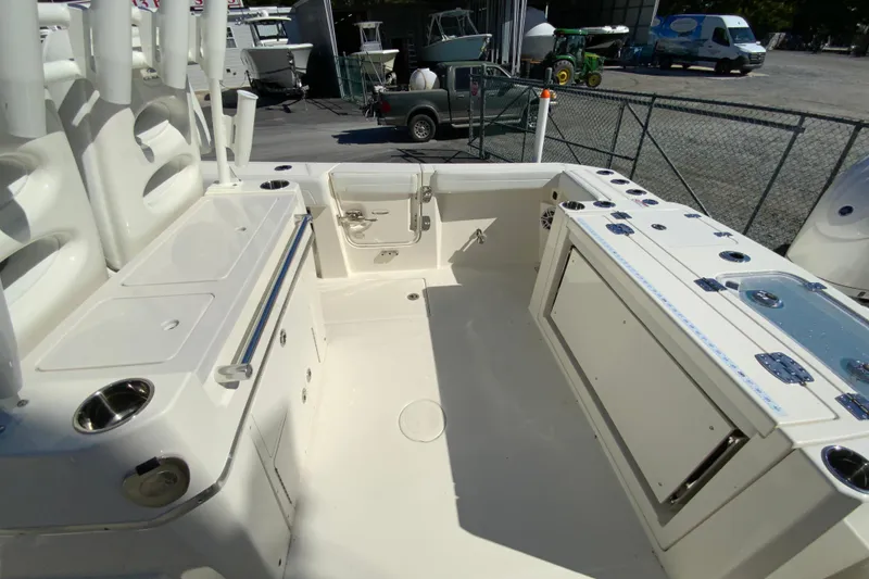 Slide: The Image of 2025 Cobia 285 Open Center Console boat interior with storage and seating features. - 13