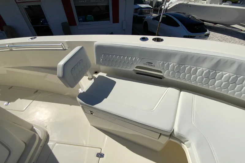 Slide: The Image of 2025 Cobia 285 Open Center Console boat interior with cushioned seating. - 42