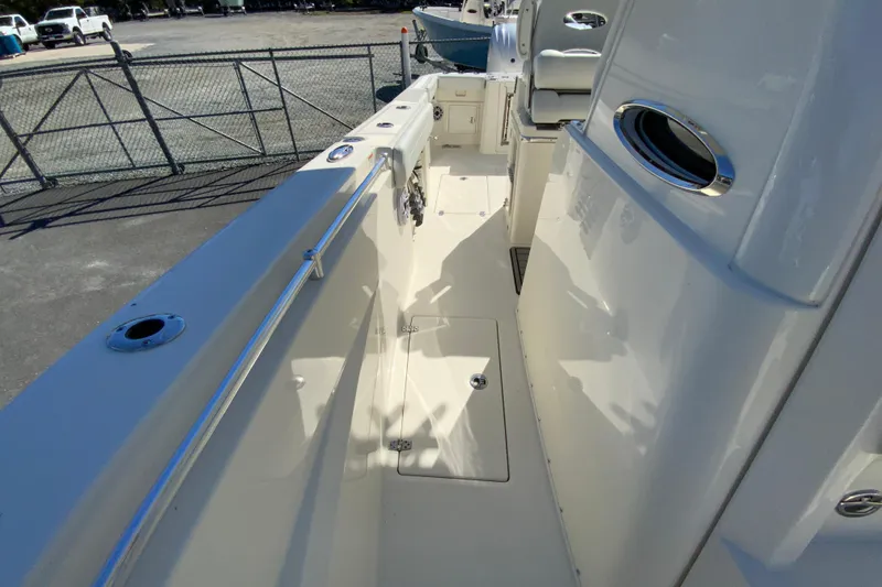 Slide: The Image of 2025 Cobia 285 Open Center Console boat deck with sleek design and modern features. - 49