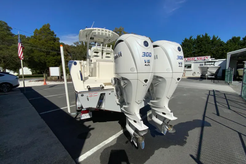 Slide: The Image of 2025 Cobia 285 Open Center Console with twin Yamaha 300 V6 engines. - 9