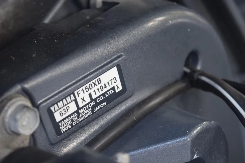 Slide: The Image of Close-up of Yamaha F150XB engine label on 2018 Sea Hunt Ultra 211 boat. - 16