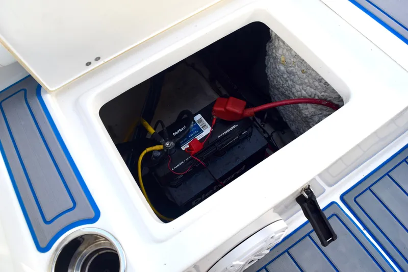 Slide: The Image of Battery compartment of 2018 Sea Hunt Ultra 211 boat with wiring and insulation. - 18